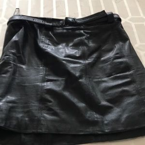 Short black leather skirt